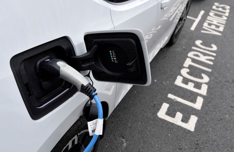 FILE PHOTO: An electric car is charged at a roadside