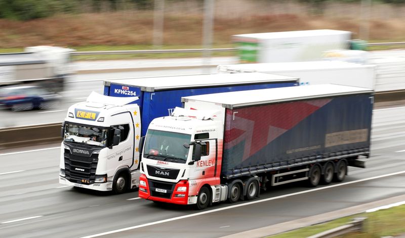 FILE PHOTO: Lorries drive on the M1 motorway amid a