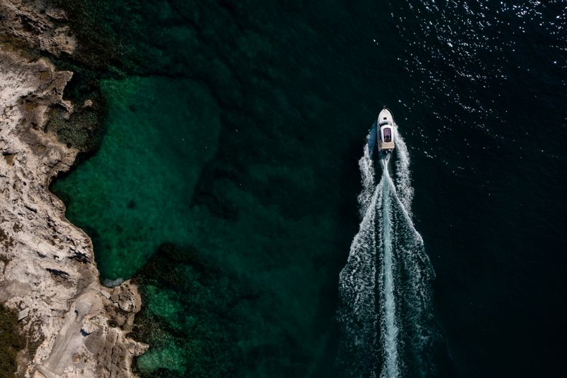 FILE PHOTO: Boat passes in the Adriatic sea in Porec