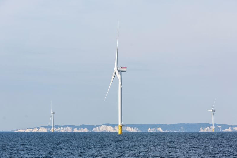 FILE PHOTO: Power-generating windmill turbines are seen at an offshore