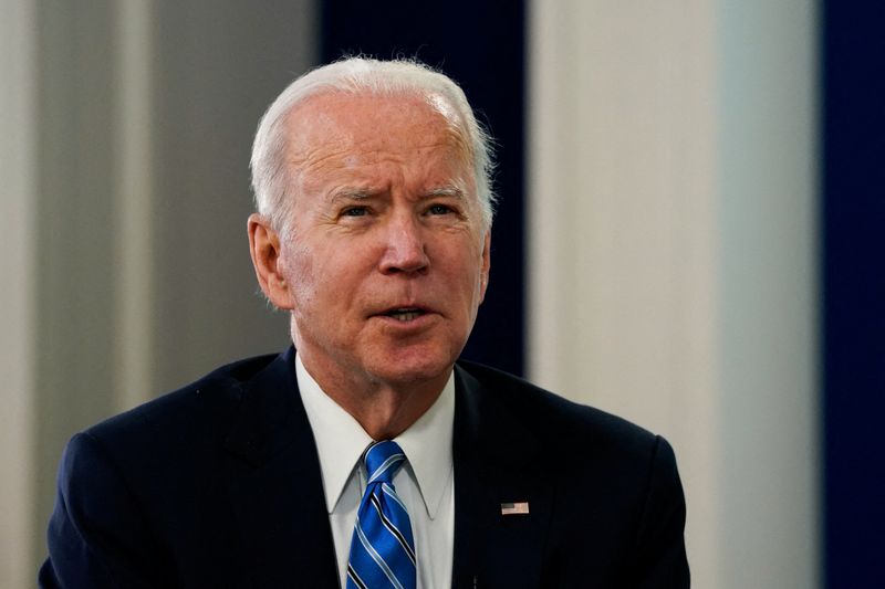 U.S. President Joe Biden talks virtually with service members, from