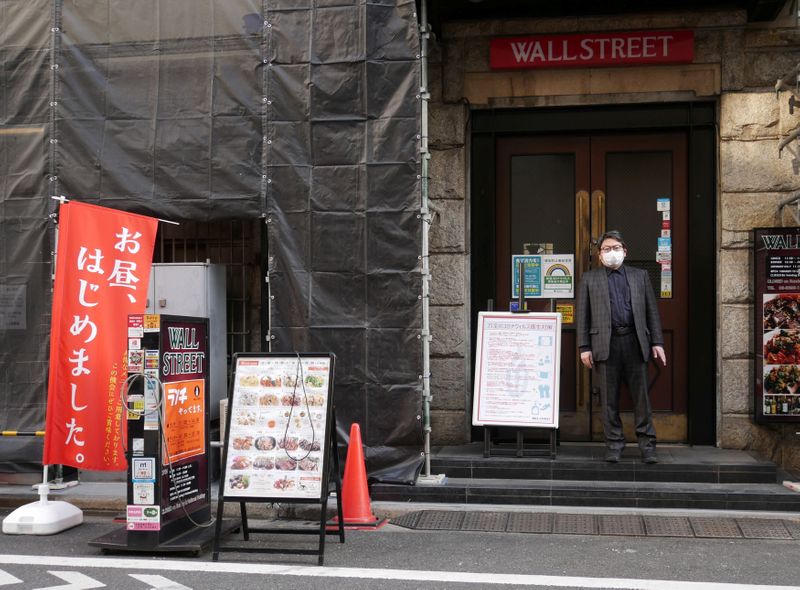 Kenichi Inoue, the owner of a restaurant named “Wall Street”