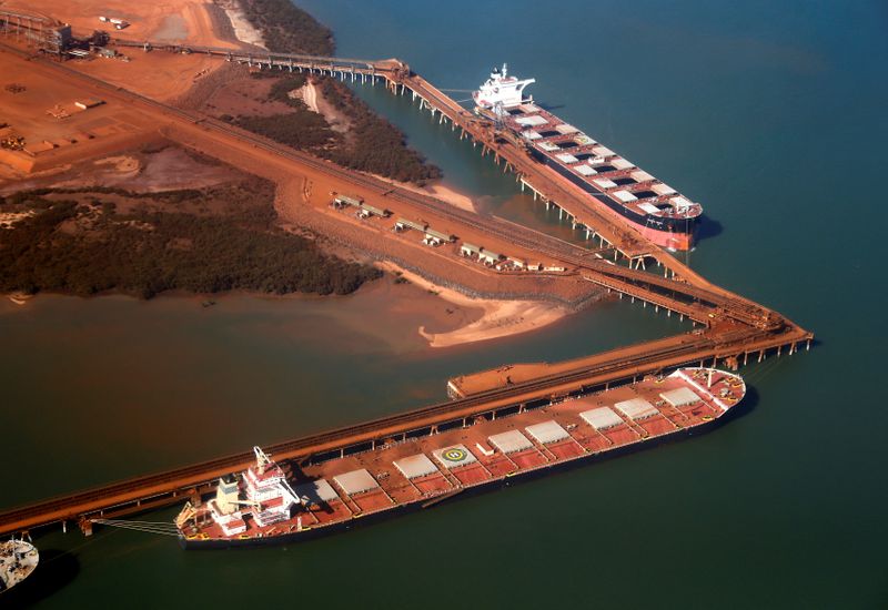FILE PHOTO: Ships waiting to be loaded with iron ore