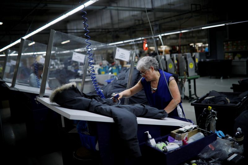 FILE PHOTO: Workers make jackets at the Canada Goose factory