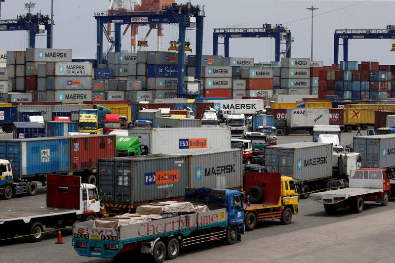FILE PHOTO: Trucks transporting containers with imported items are prepared
