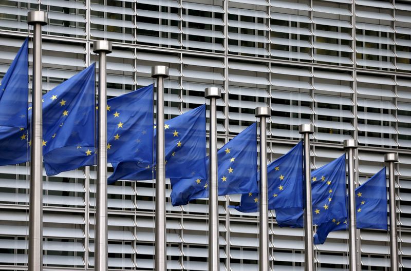 FILE PHOTO: Picture shows European Union flags fluttering outside the