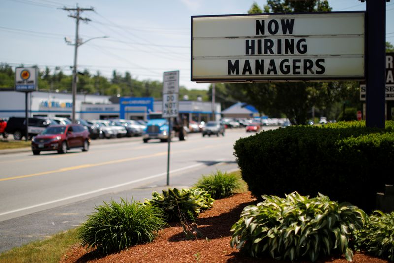 The sign on a Taco Bell restaurant advertises “Now Hiring