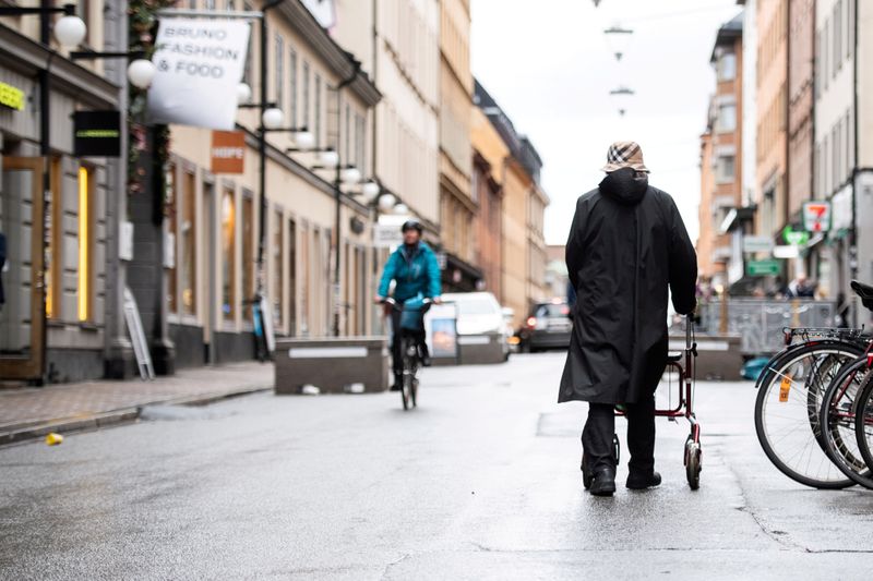 FILE PHOTO: Woman strolls through the Sodermalm area of Stockholm