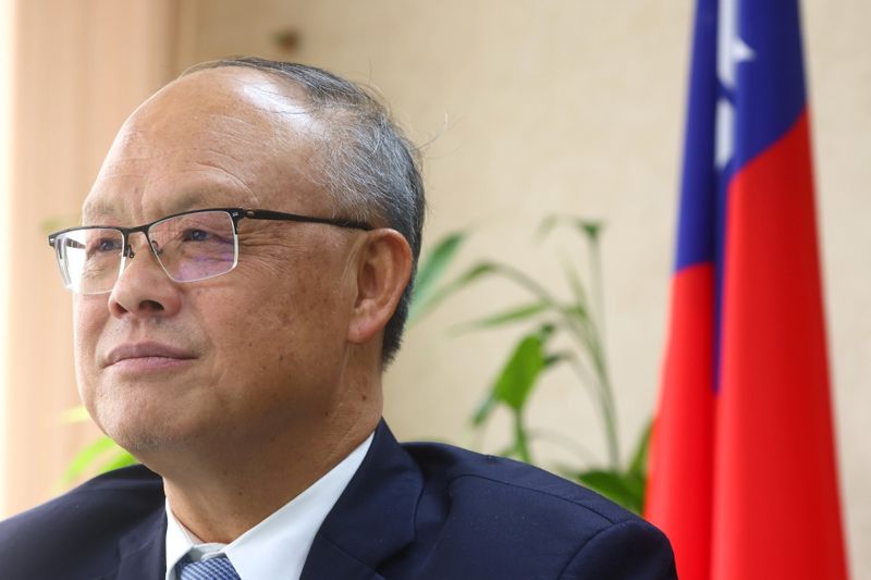 Taiwan’s Chief trade negotiator John Deng looks on as he