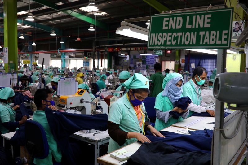 FILE PHOTO: Garment employees work at Fakhruddin Textile Mills Limited