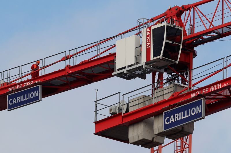 A worker walks along a crane on Carillion’s Midland Metropolitan