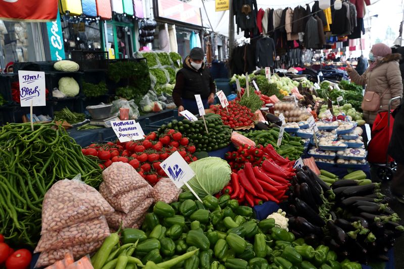 People shop at a local market in Fatih district in