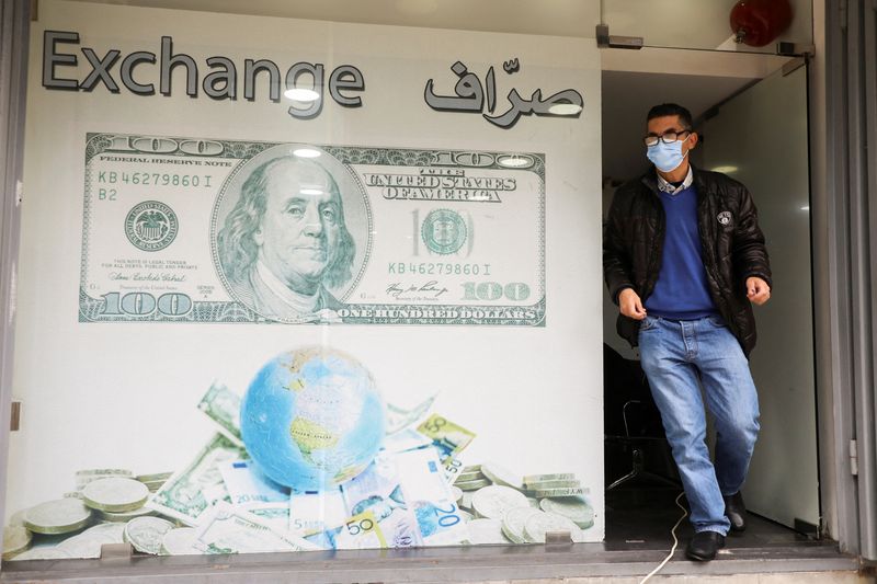 A man leaves a currency exchange shop in Beirut