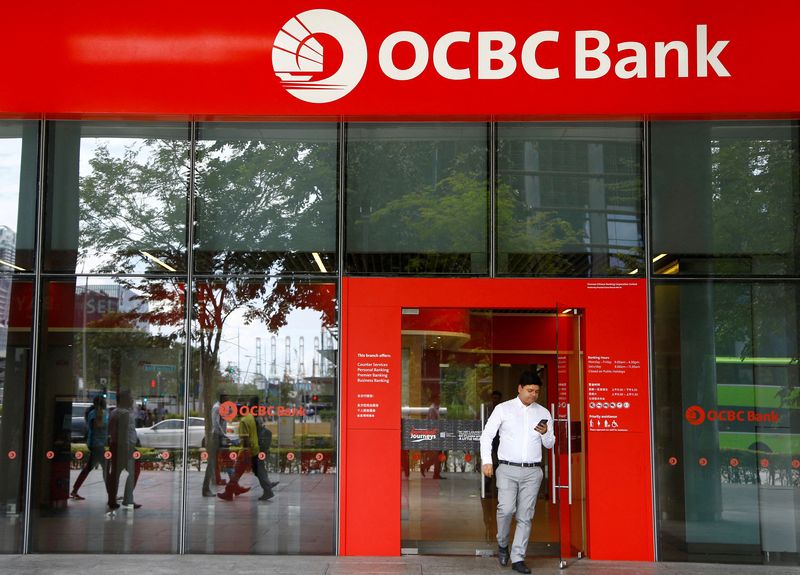 FILE PHOTO: A man walks out of an OCBC Bank