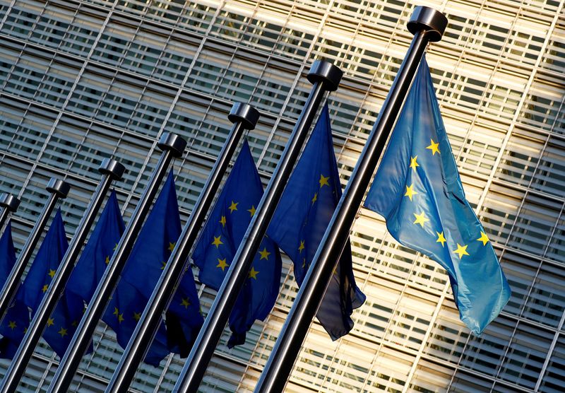 FILE PHOTO: EU flags are seen outside the EU Commission