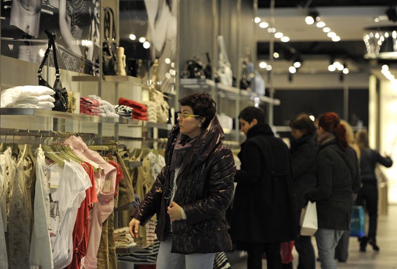 Shoppers browse clothes in a store in London