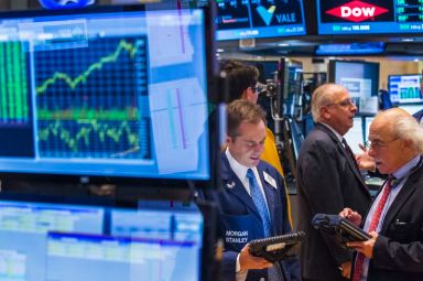 Traders work on the floor of the New York Stock
