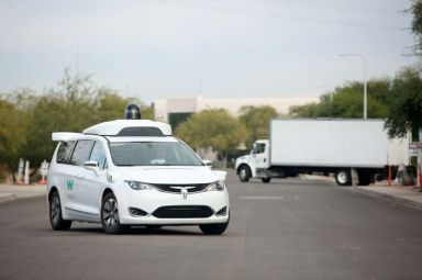 FILE PHOTO: A Waymo Chrysler Pacifica Hybrid self-driving vehicle returns