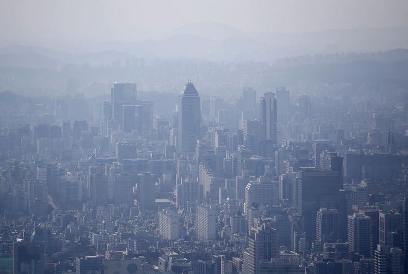 The skyline of central Seoul is seen during a foggy
