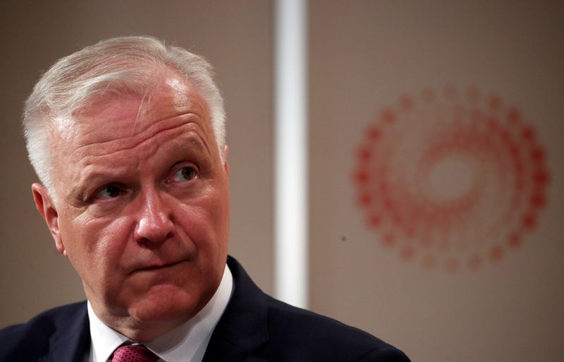 Governor of the Bank of Finland, Olli Rehn attends a