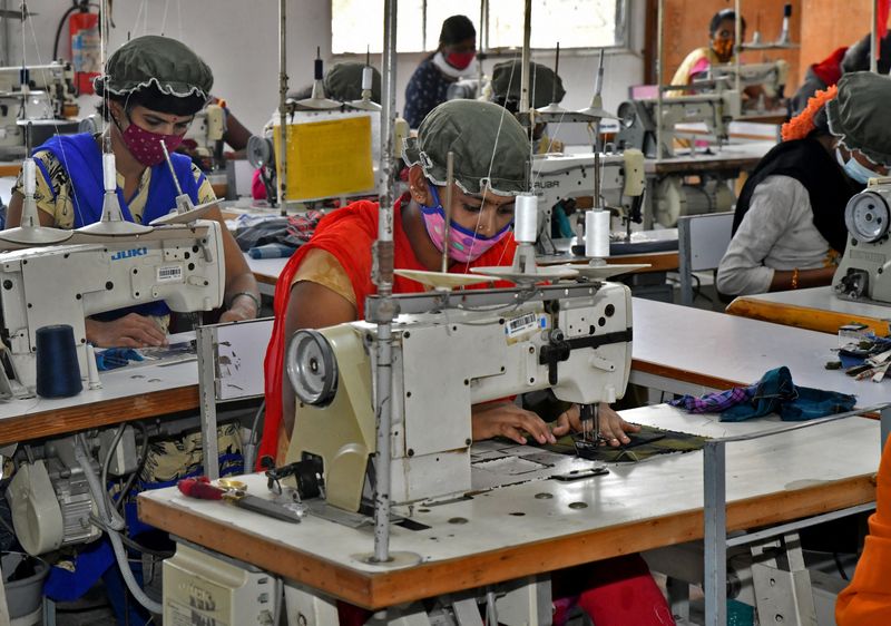 Newly recruited garment workers practice stitching at a textile factory