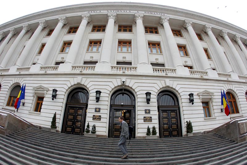 A man walks in front of Romania’s Central Bank headquarters