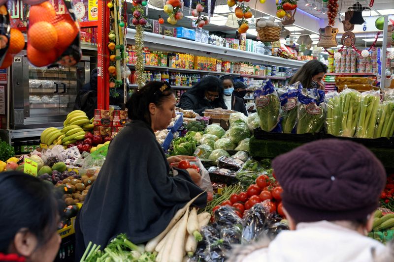 FILE PHOTO: People shop at a supermarket amid the coronavirus