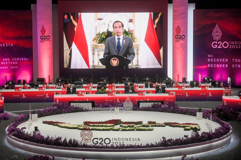 Indonesia President Joko Widodo is seen on a screen delivering
