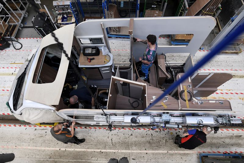 FILE PHOTO: Workers assemble a camper at the Knaus-Tabbert AG