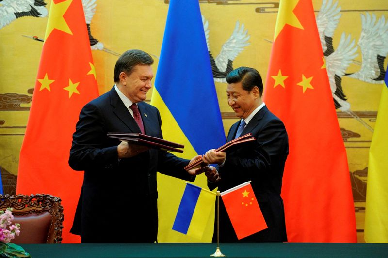 FILE PHOTO: Ukraine’s then president Yanukovich and Chinese President Xi