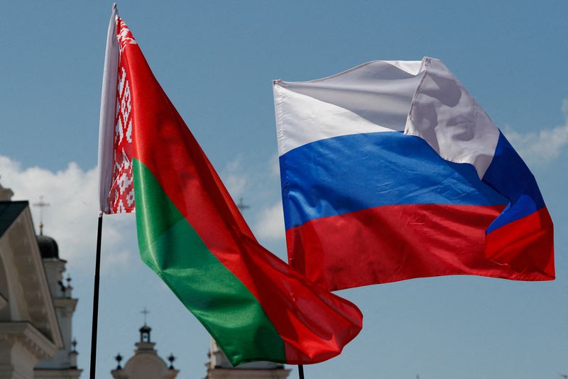 FILE PHOTO: Belarusian and Russian national flags fly during “Day