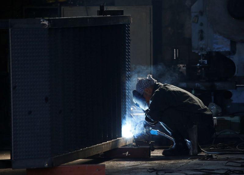 A man works at a factory at the Keihin industrial