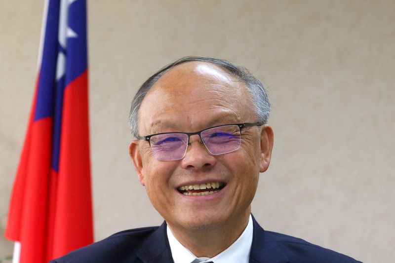 FILE PHOTO: Taiwan’s Chief trade negotiator John Deng speaks to