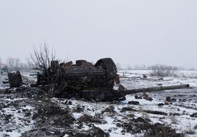 A destroyed armoured vehicle is seen in the separatist-controlled village
