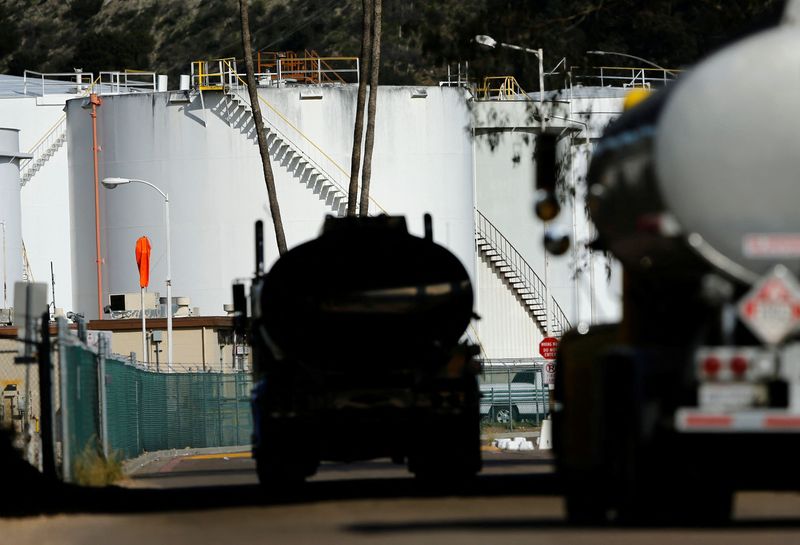 FILE PHOTO: Gasoline trucks arrive to refill their tankers at