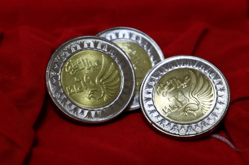 Coins of a one Egyptian pound are seen at the