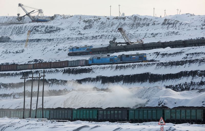 FILE PHOTO: Trains are loaded with coal at Russia’s largest