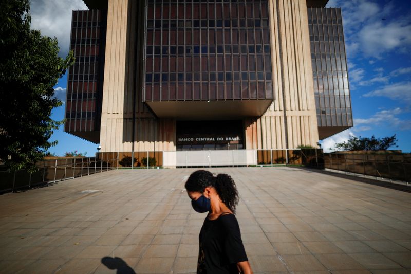 A woman walks in front the Central Bank headquarters building