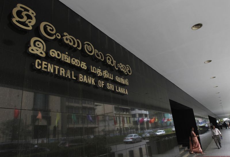 People walk at the Central Bank of Sri Lanka building