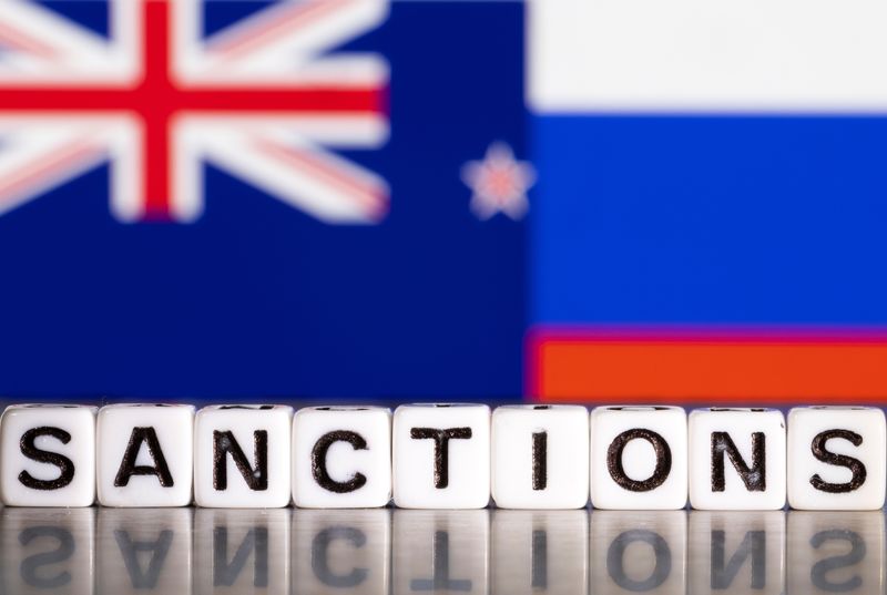 Illustration shows letters arranged to read “Sanctions” in front of