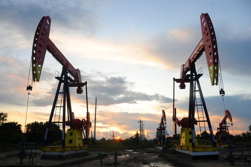 FILE PHOTO: Pumpjacks are seen during sunset at the Daqing