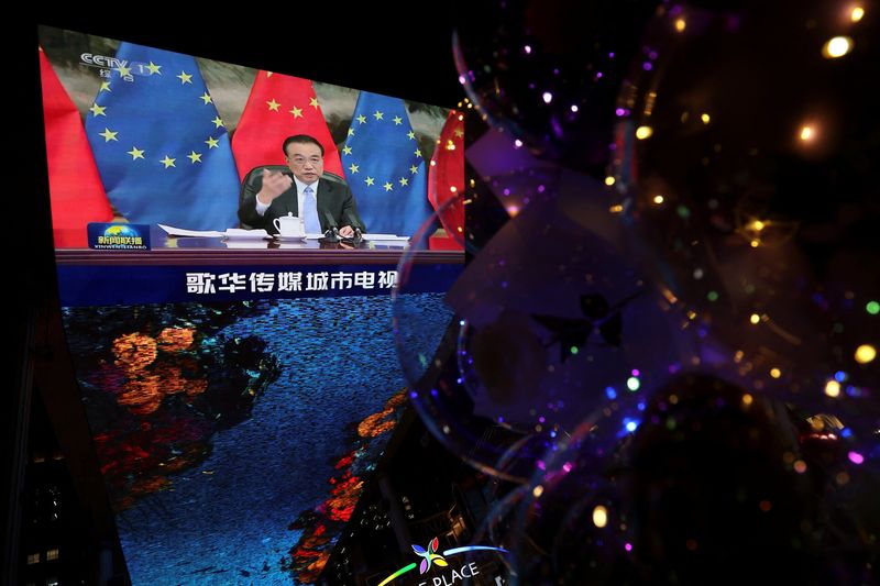 A giant screen shows EU-China virtual summit, in Beijing