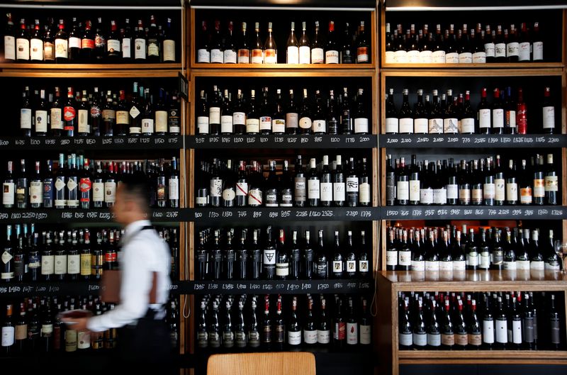 FILE PHOTO: A server passes a wine rack at the