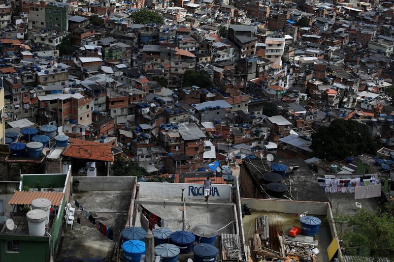 A man looks on over the Rocinha slum from he