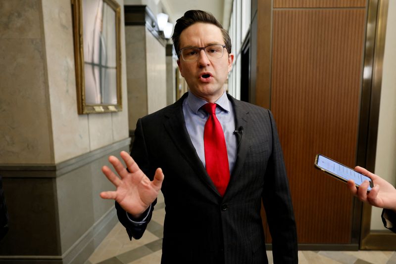 FILE PHOTO: Conservative leadership candidate Poilievre speaks to journalists on