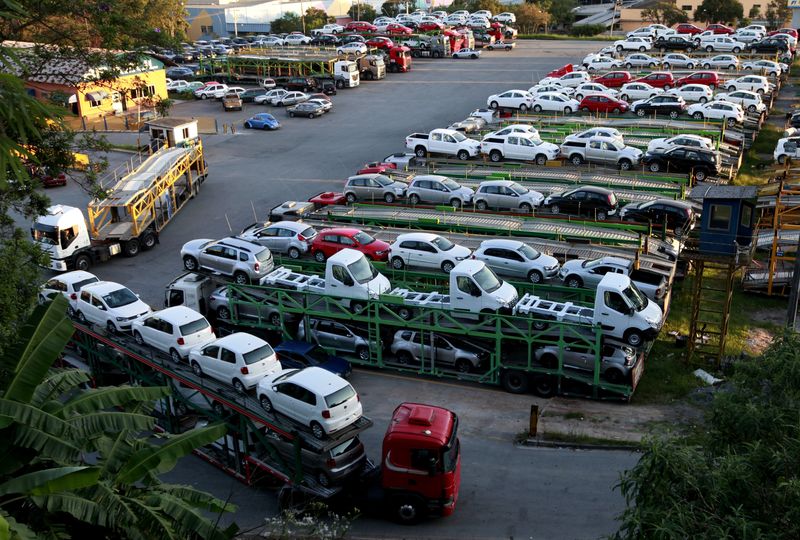 FILE PHOTO: New cars are transported in a truck in
