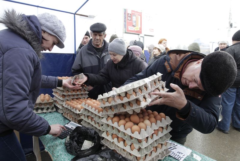 FILE PHOTO: Customers visit a food market in Stavropol