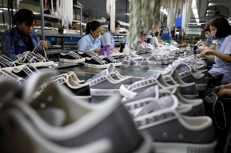 The making of shoes for export at a factory in