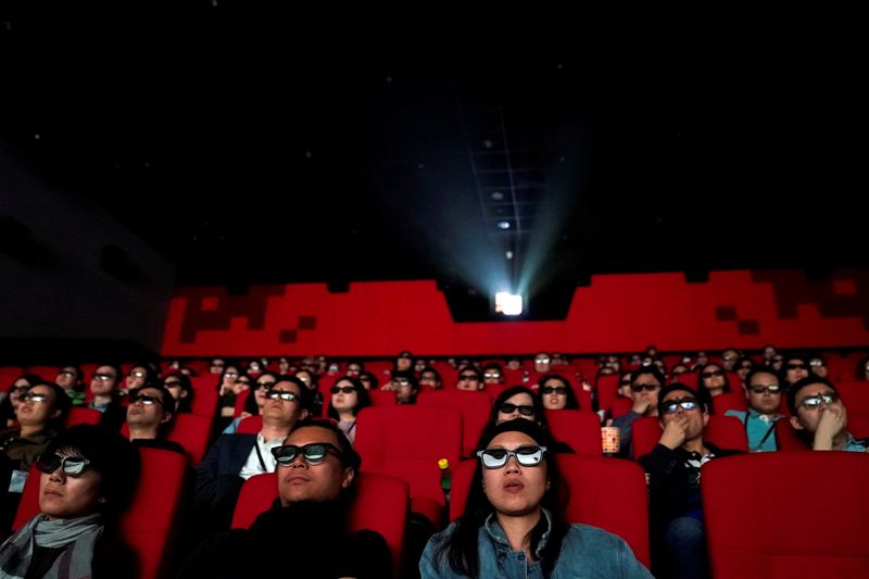 FILE PHOTO: People watch a movie at a cinema in