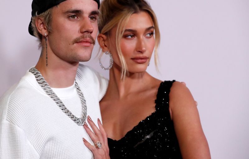 FILE PHOTO: Singer Bieber and his wife Hailey Baldwin pose